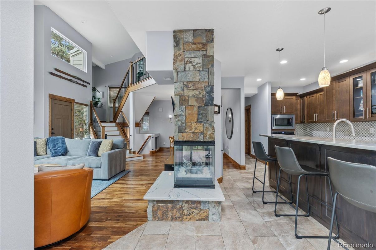 Fireplace, Interior, Kitchen, Living room, Pendant Lights, Recessed Lighting, Stone Walls, Wood Texture Flooring