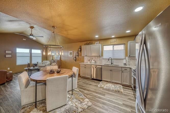 Dining room, Interior, Kitchen, Pendant Lights, Recessed Lighting, Stainless Steel Appliances, Water, Wood Texture Flooring