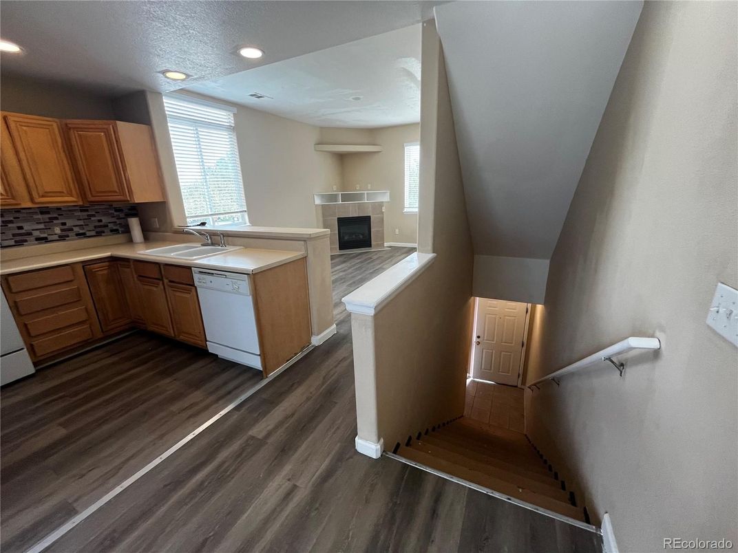 Fireplace, Interior, Kitchen, Recessed Lighting, Wood Texture Flooring