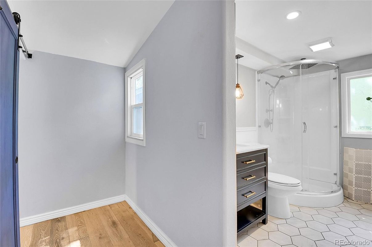 Bathroom, Glass Shower, Interior, Pendant Lights, Recessed Lighting, Wood Texture Flooring