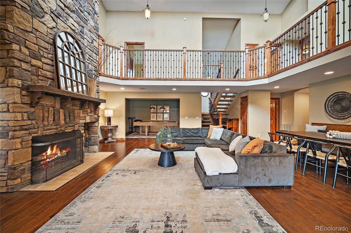 Dining room, Fireplace, Interior, Living room, Pendant Lights, Recessed Lighting, Stone Walls, Wood Texture Flooring