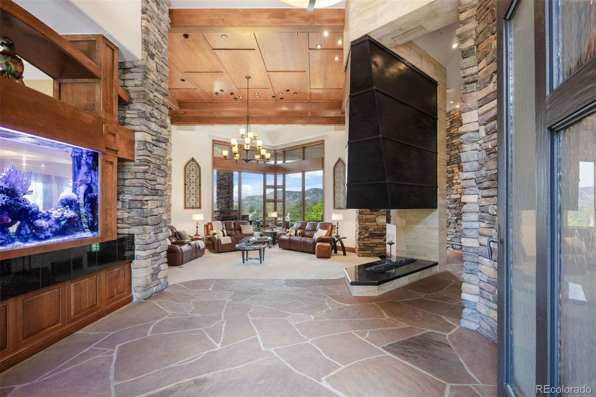 Chandelier, Fireplace, Interior, Living room, Recessed Lighting, Stone Walls, Wooden Ceilings