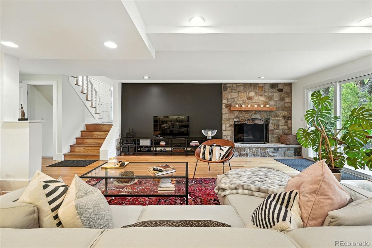Fireplace, Interior, Living room, Recessed Lighting, Stone Walls, Wood Texture Flooring