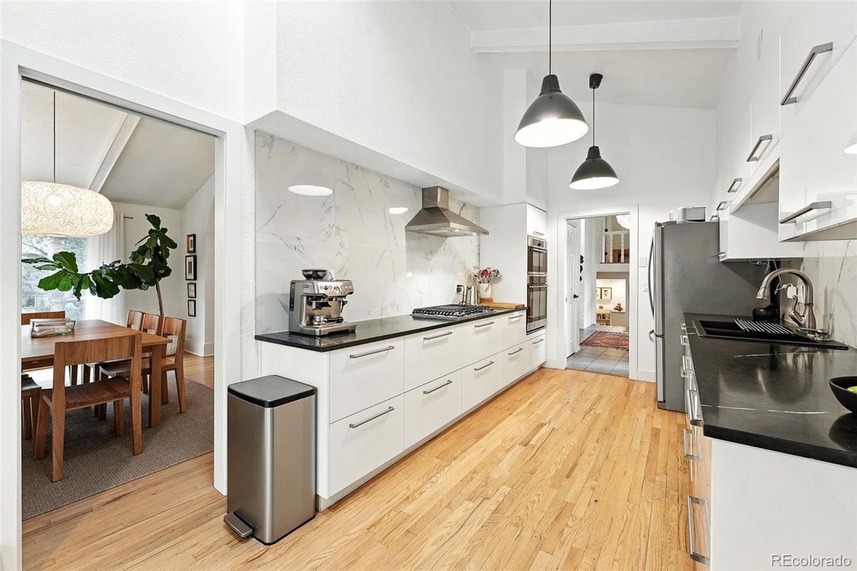 Dining room, Interior, Kitchen, Marble Walls, Pendant Lights, Stainless Steel Appliances, Wood Texture Flooring