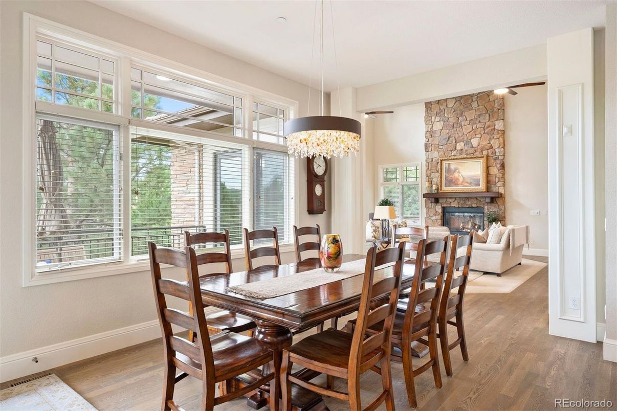 Chandelier, Dining room, Fireplace, Interior, Living room, Pendant Lights, Stone Walls, Wood Texture Flooring