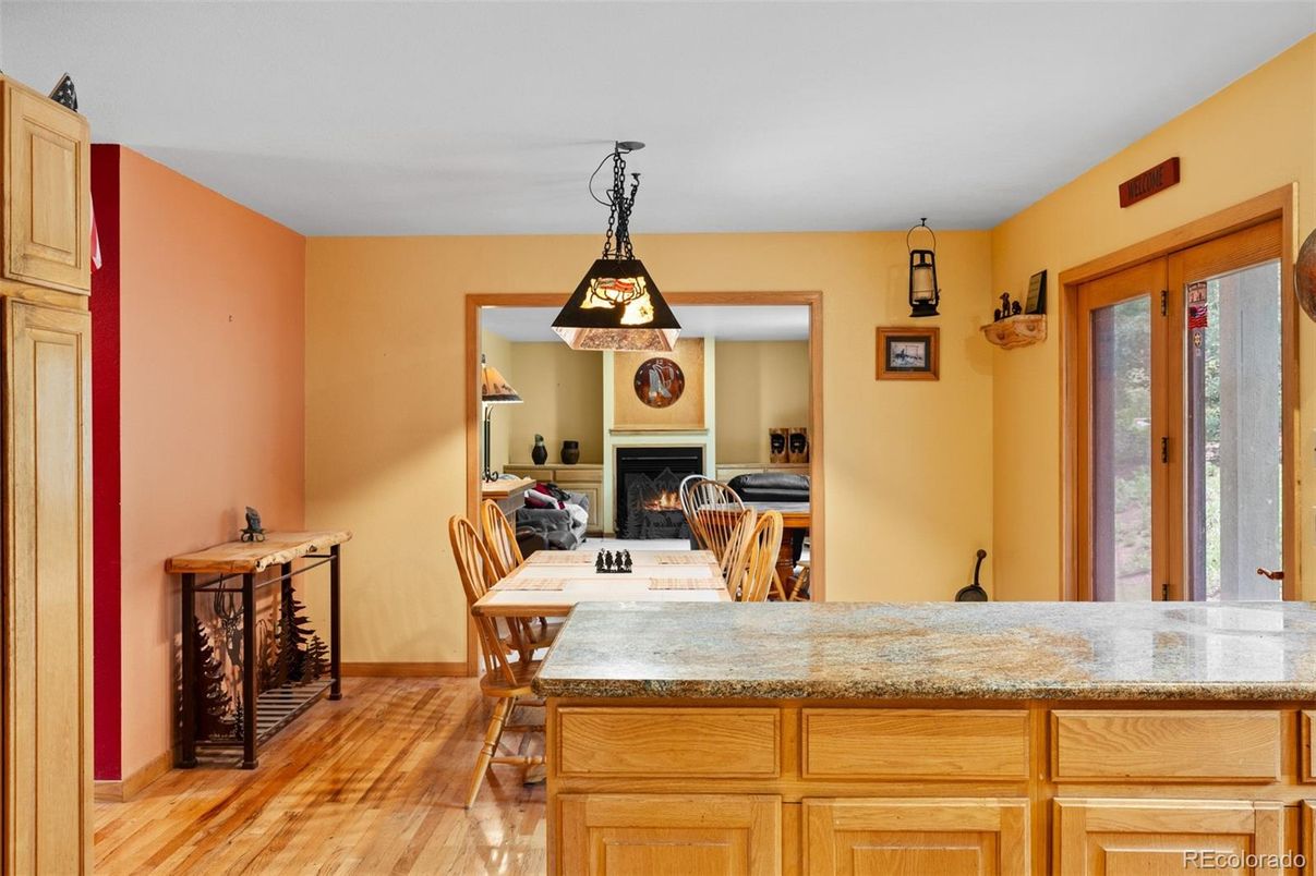 Dining room, Fireplace, Interior, Pendant Lights, Wood Texture Flooring
