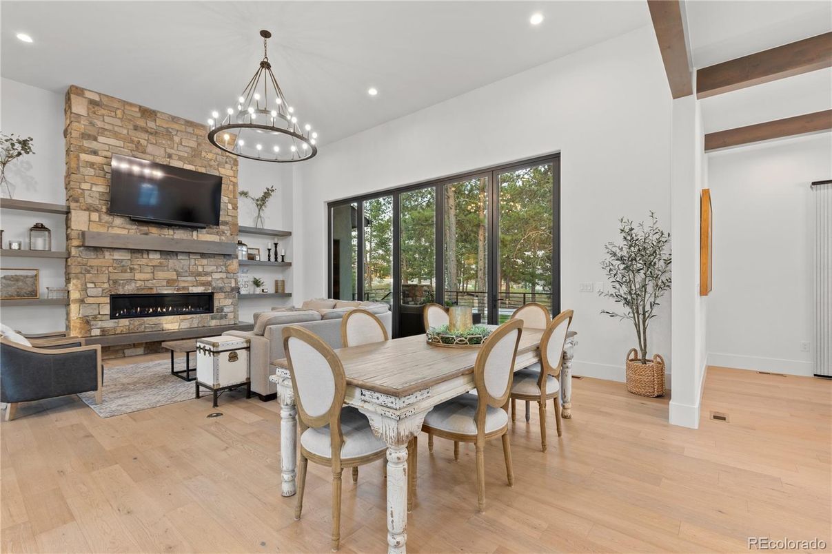 Dining room, Fireplace, Interior, Living room, Pendant Lights, Recessed Lighting, Stone Walls, Wood Texture Flooring