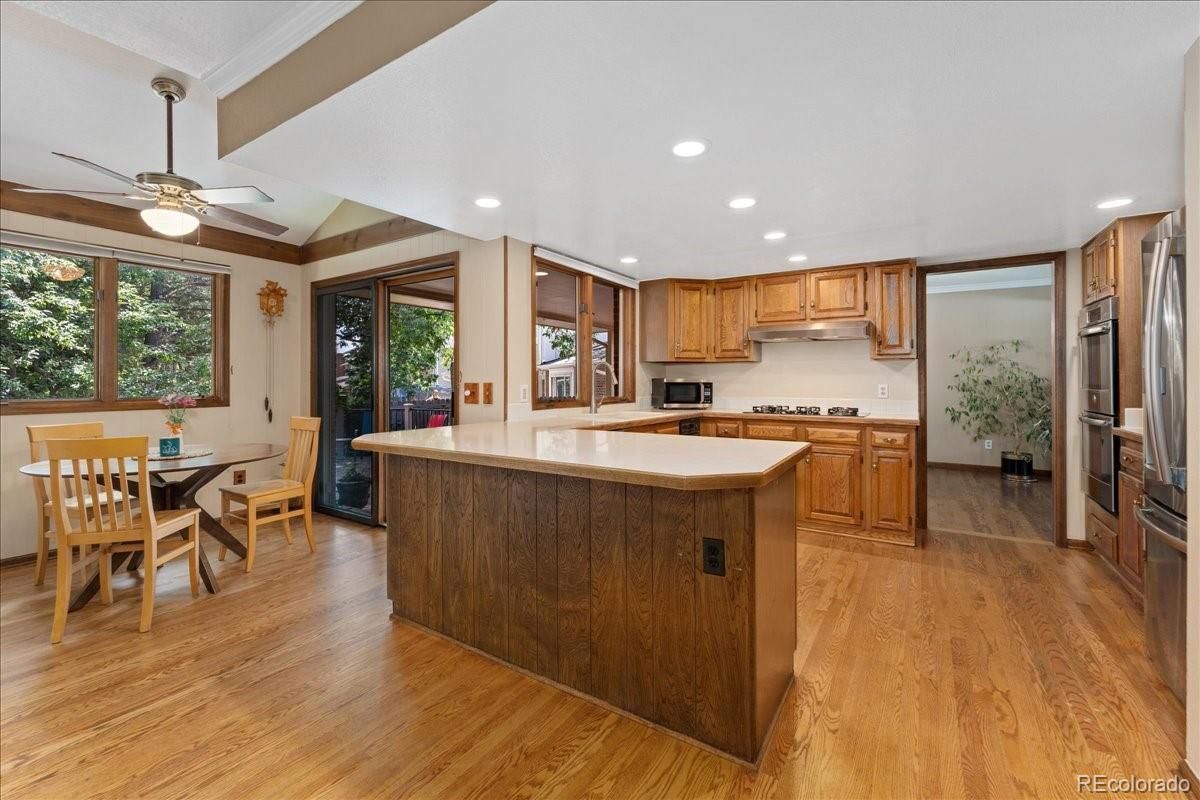 Dining room, Interior, Kitchen, Recessed Lighting, Stainless Steel Appliances, Wood Texture Flooring