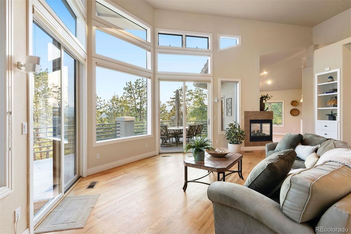 Fireplace, Interior, Living room, Recessed Lighting, Sun Room, Wood Texture Flooring