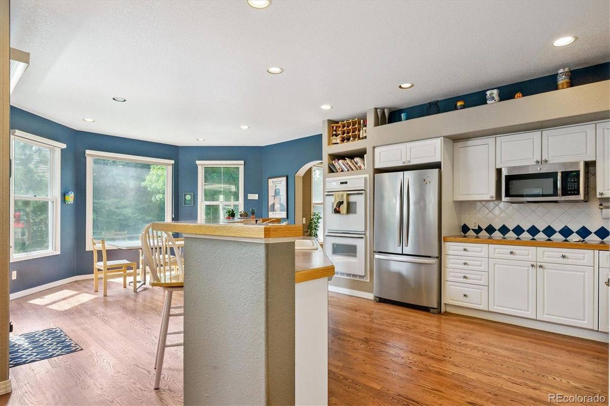Dining room, Interior, Kitchen, Recessed Lighting, Stainless Steel Appliances, Wood Texture Flooring