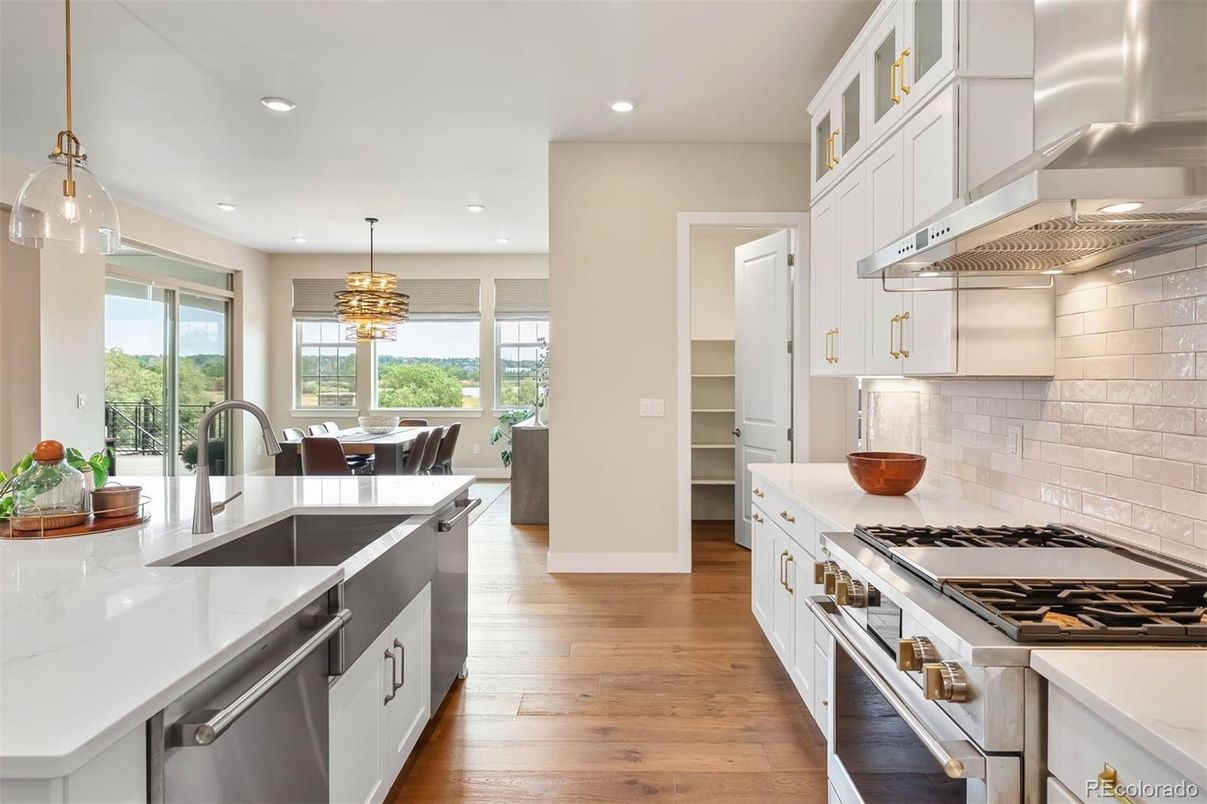 Chandelier, Dining room, Interior, Kitchen, Pendant Lights, Recessed Lighting, Stainless Steel Appliances, Wood Texture Flooring