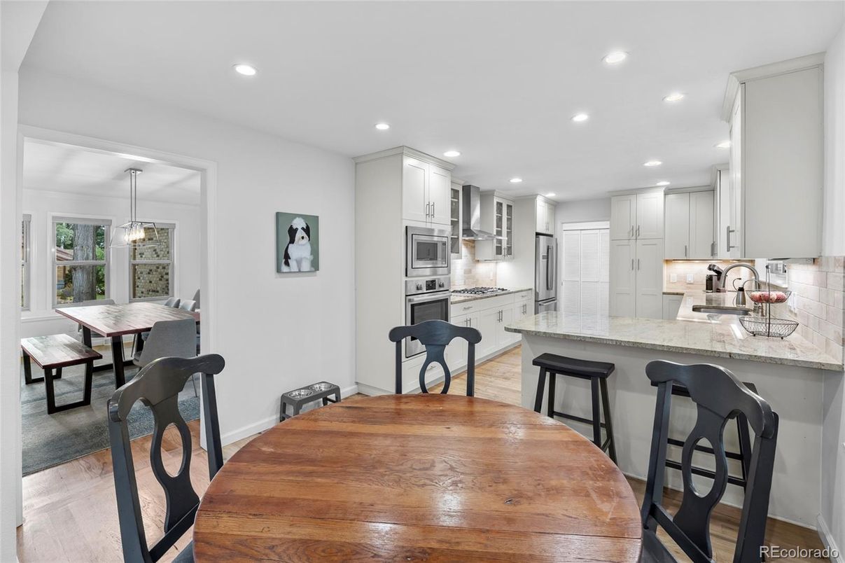 Dining room, Interior, Kitchen, Pendant Lights, Recessed Lighting, Stainless Steel Appliances, Wood Texture Flooring