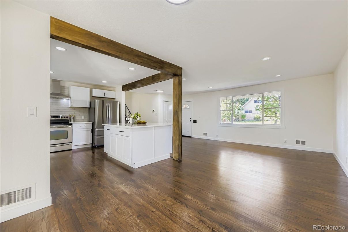 Empty room, Interior, Kitchen, Recessed Lighting, Stainless Steel Appliances, Wooden Beams, Wood Texture Flooring