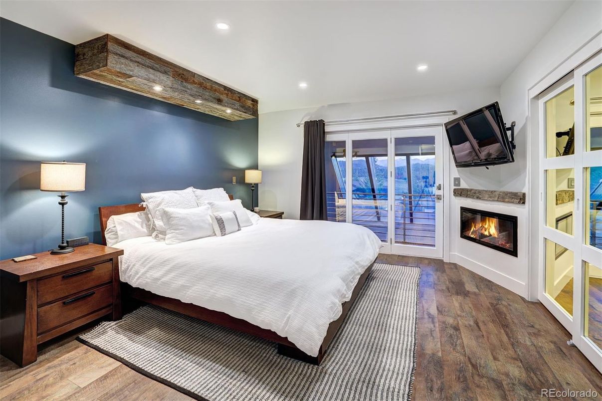 Bedroom, Fireplace, Interior, Recessed Lighting, Water, Wood Texture Flooring