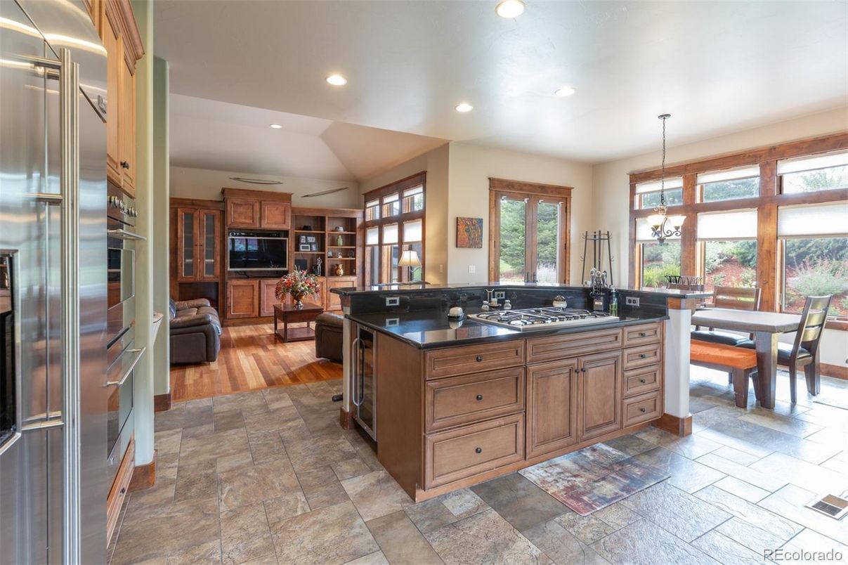 Dining room, Interior, Kitchen, Living room, Pendant Lights, Recessed Lighting, Stainless Steel Appliances, Wood Texture Flooring