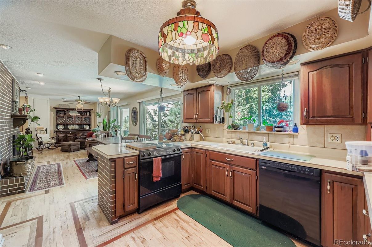 Chandelier, Dining room, Fireplace, Interior, Kitchen, Living room, Recessed Lighting, Wood Texture Flooring