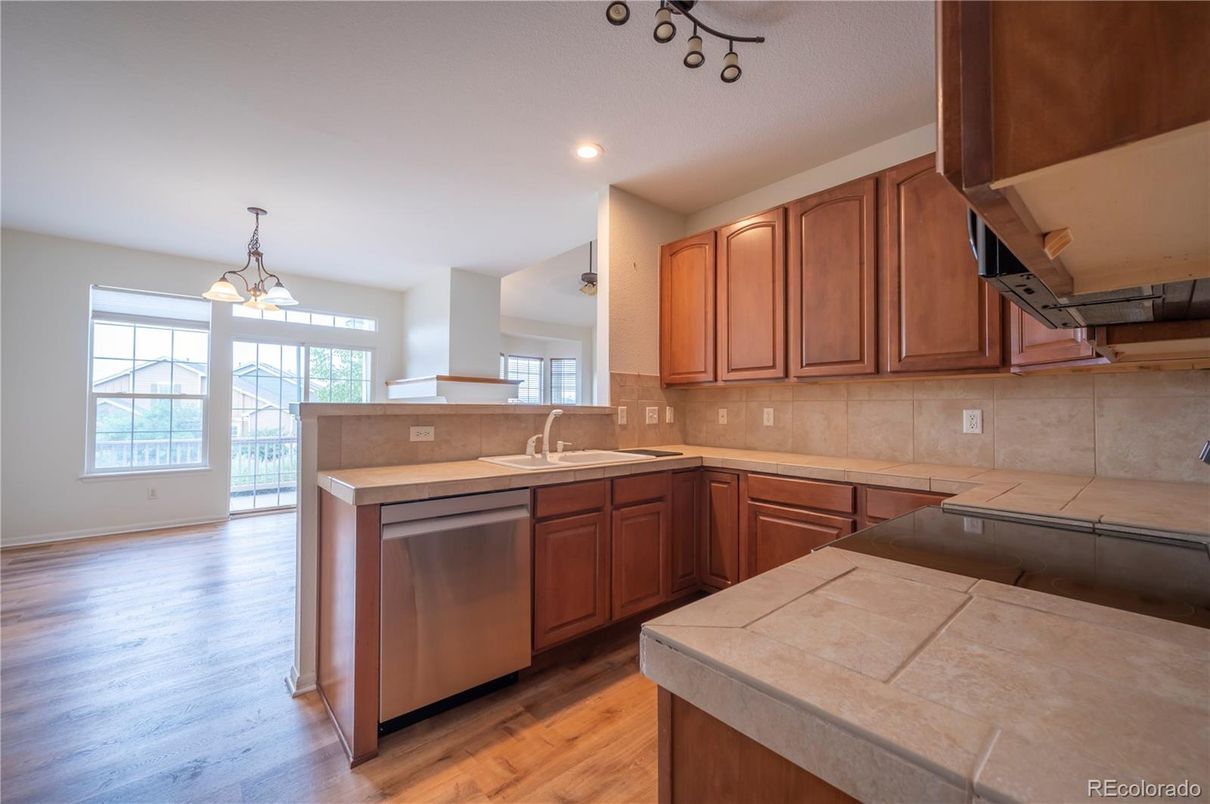 Interior, Kitchen, Pendant Lights, Recessed Lighting, Tile Countertops, Wood Texture Flooring