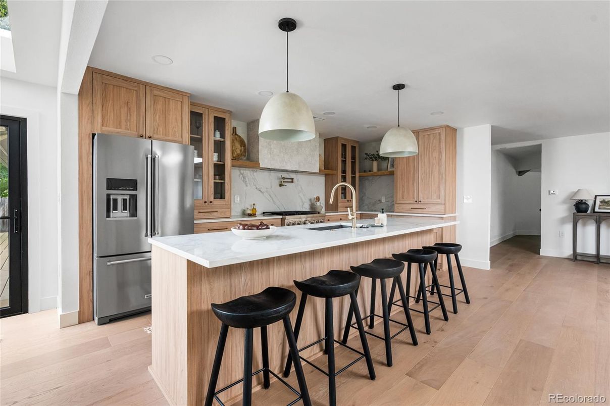 Interior, Kitchen, Marble Walls, Pendant Lights, Recessed Lighting, Stainless Steel Appliances, Wood Texture Flooring