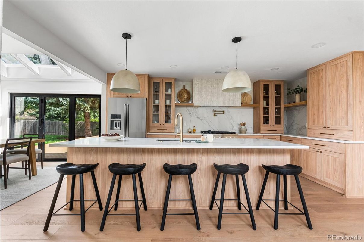 Interior, Kitchen, Marble Walls, Pendant Lights, Recessed Lighting, Stainless Steel Appliances, Wood Texture Flooring