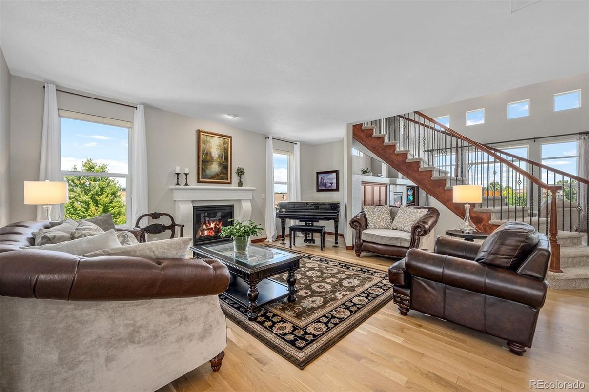 Fireplace, Interior, Living room, Piano, Recessed Lighting, Wood Texture Flooring