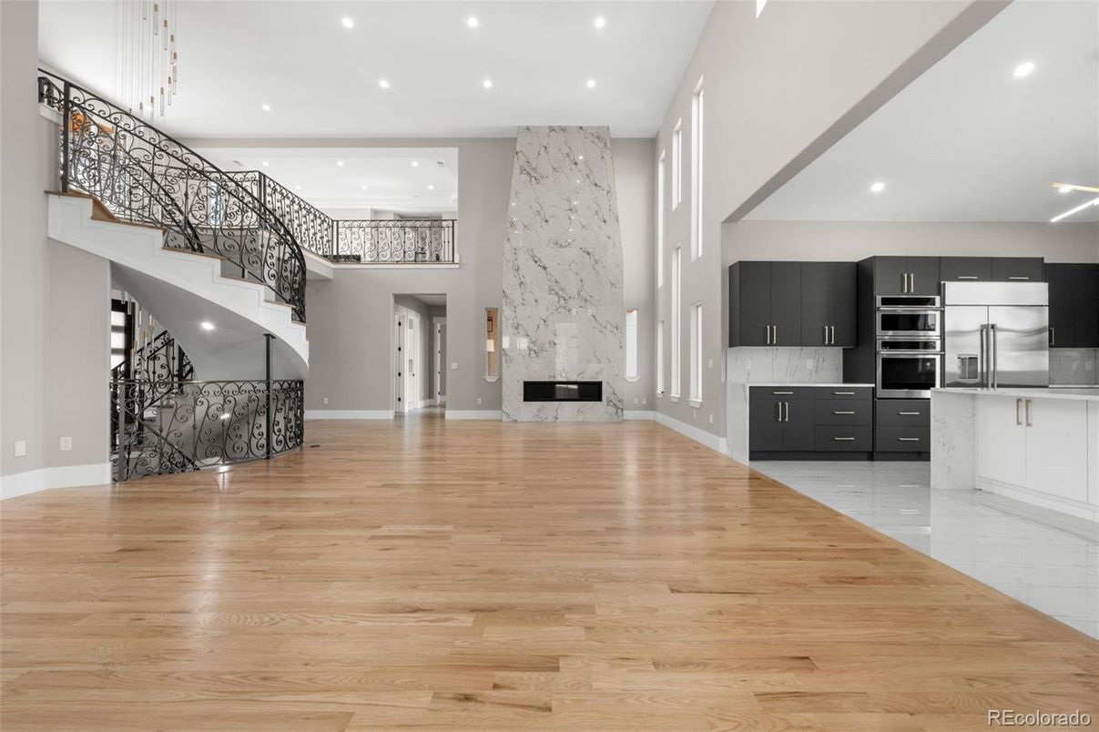 Interior, Kitchen, Marble Walls, Recessed Lighting, Stainless Steel Appliances, Wood Texture Flooring