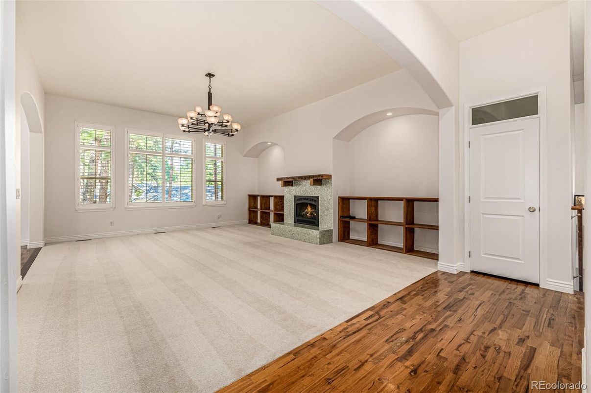 Chandelier, Empty room, Fireplace, Interior, Recessed Lighting, Wood Texture Flooring