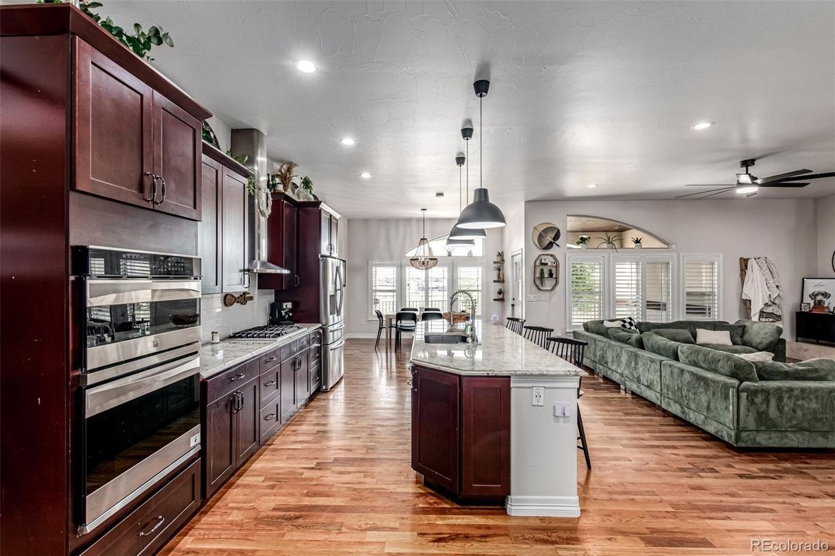 Dining room, Interior, Kitchen, Living room, Pendant Lights, Recessed Lighting, Stainless Steel Appliances, Wood Texture Flooring