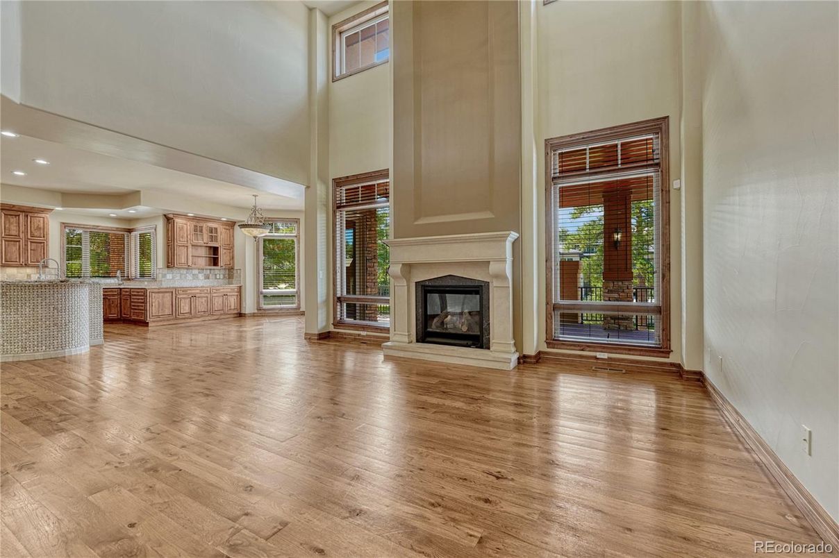 Empty room, Fireplace, Interior, Kitchen, Pendant Lights, Recessed Lighting, Wood Texture Flooring