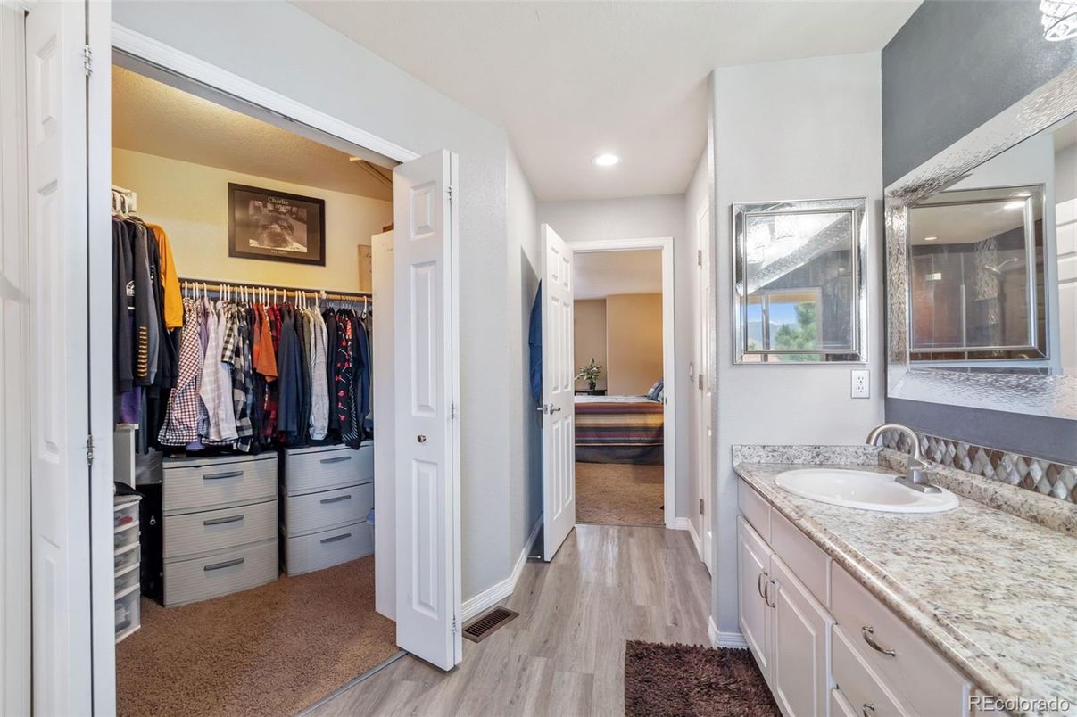 Bathroom, Dual Sink Vanities, Interior, Recessed Lighting, Walk-in Closets, Wood Texture Flooring