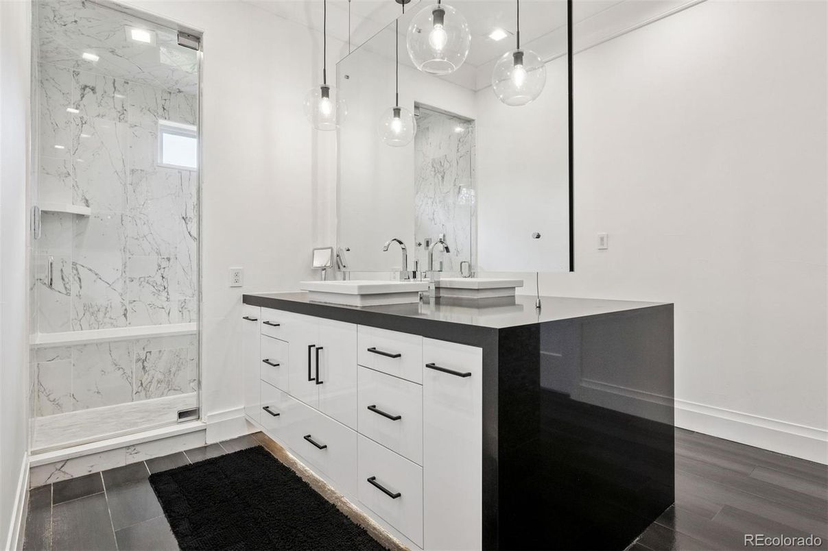 Bathroom, Dual Sink Vanities, Glass Shower, Interior, Marble Walls, Pendant Lights, Wood Texture Flooring