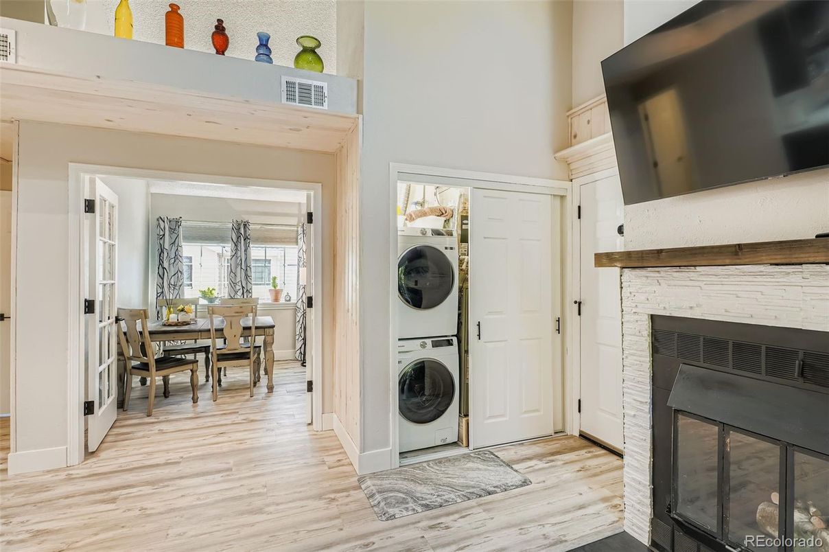 Dining room, Fireplace, Interior, Utility Closets, Washer, Wood Texture Flooring