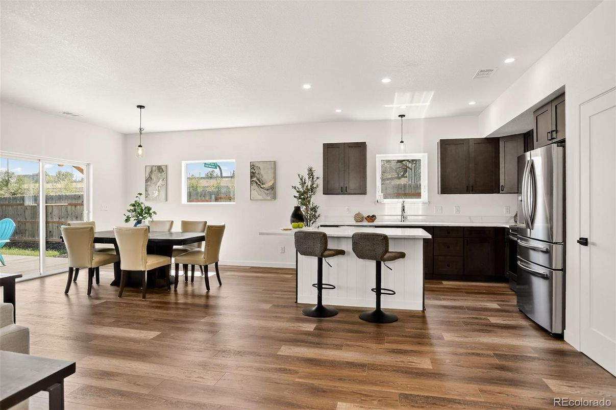 Dining room, Interior, Kitchen, Pendant Lights, Recessed Lighting, Stainless Steel Appliances, Wood Texture Flooring