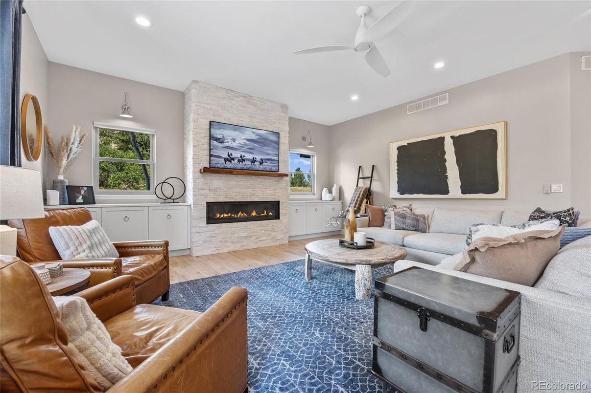Fireplace, Interior, Living room, Recessed Lighting, Stone Walls, Wood Texture Flooring