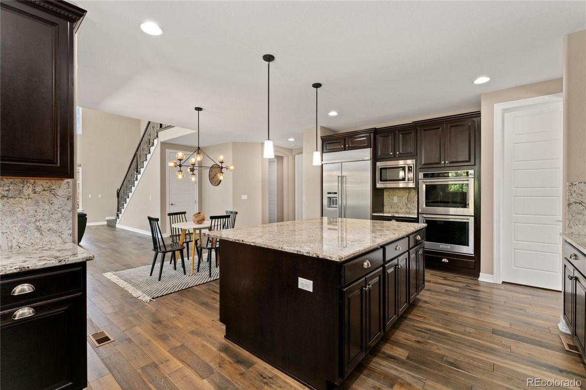Dining room, Interior, Kitchen, Pendant Lights, Recessed Lighting, Stainless Steel Appliances, Wood Texture Flooring