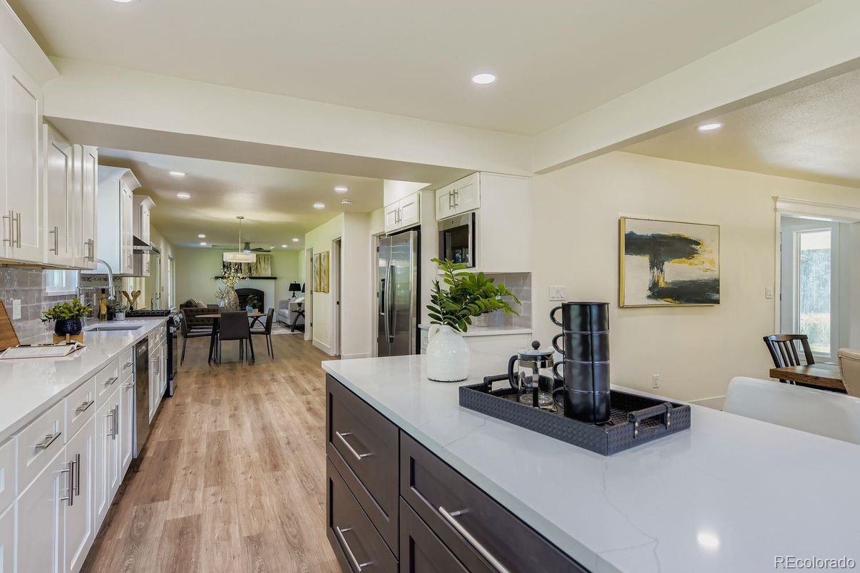 Dining room, Interior, Kitchen, Pendant Lights, Recessed Lighting, Stainless Steel Appliances, Wood Texture Flooring