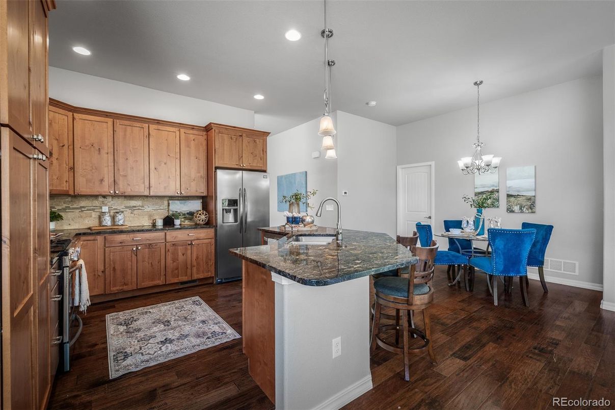 Chandelier, Dining room, Interior, Kitchen, Pendant Lights, Recessed Lighting, Stainless Steel Appliances, Wood Texture Flooring