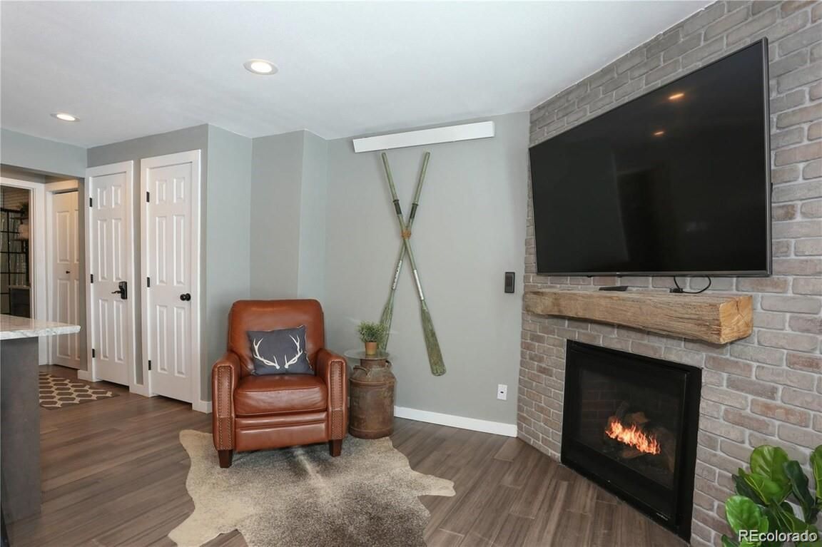 Fireplace, Interior, Recessed Lighting, Stone Walls, Wood Texture Flooring