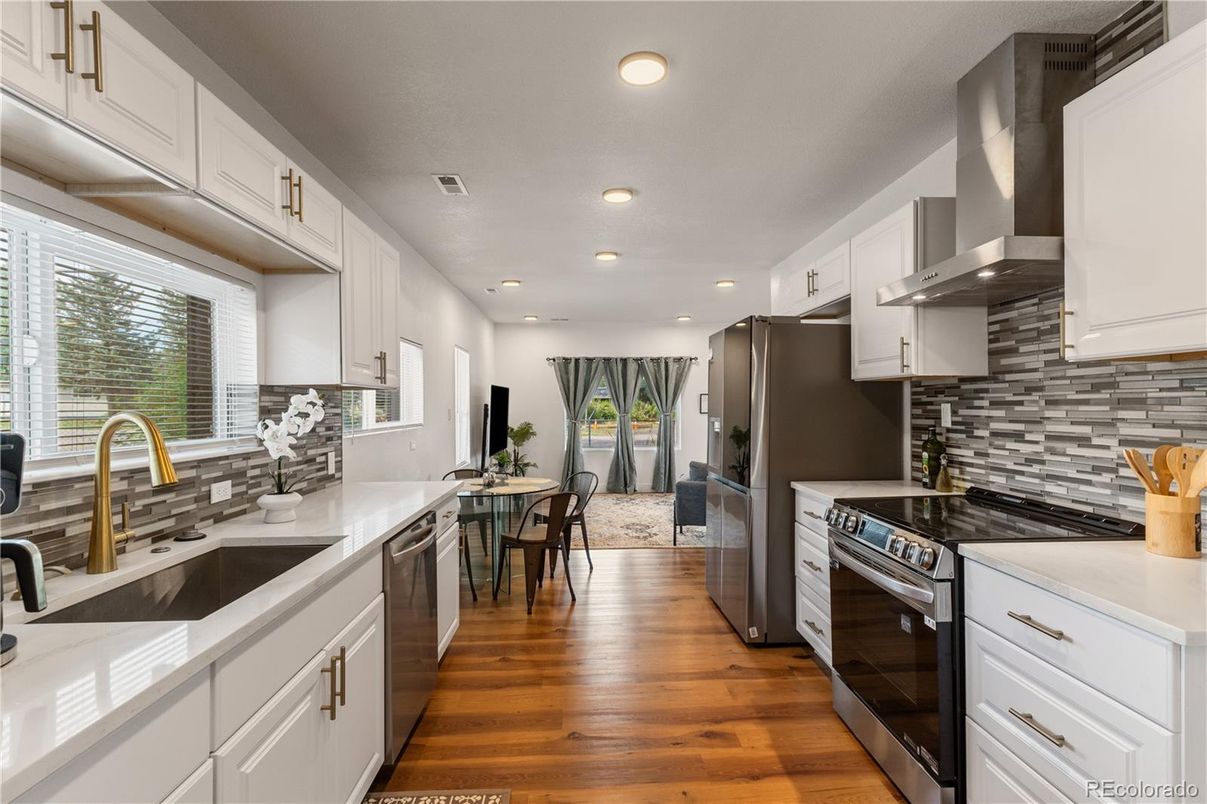 Dining room, Interior, Kitchen, Recessed Lighting, Stainless Steel Appliances, Wood Texture Flooring