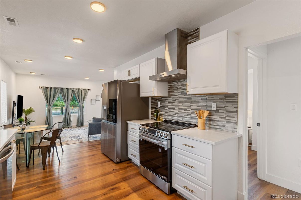 Dining room, Interior, Kitchen, Recessed Lighting, Stainless Steel Appliances, Wood Texture Flooring