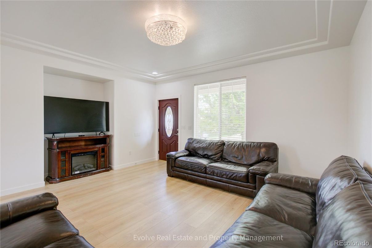 Chandelier, Fireplace, Interior, Living room, Recessed Lighting, Wood Texture Flooring