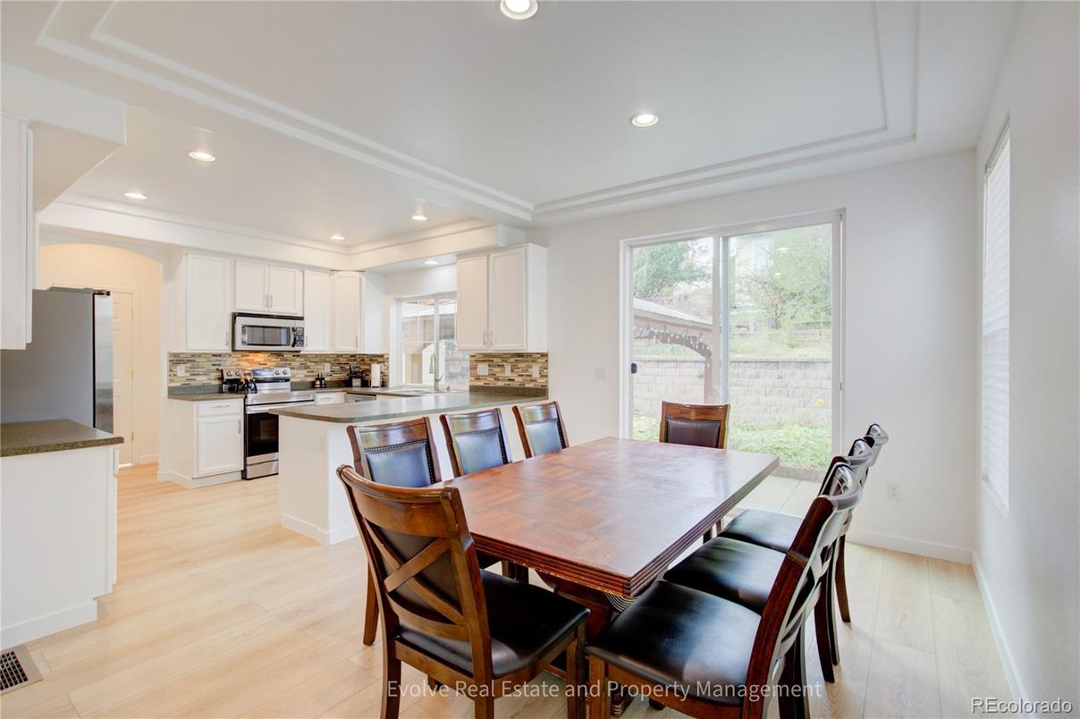 Dining room, Interior, Kitchen, Recessed Lighting, Stainless Steel Appliances, Wood Texture Flooring