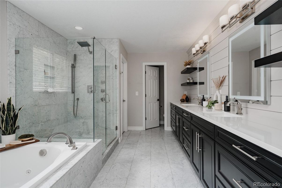 Bathroom, Dual Sink Vanities, Glass Shower, Interior, Marble Walls, Recessed Lighting