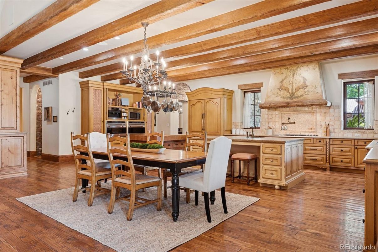 Chandelier, Dining room, Interior, Kitchen, Recessed Lighting, Stainless Steel Appliances, Wooden Beams, Wood Texture Flooring