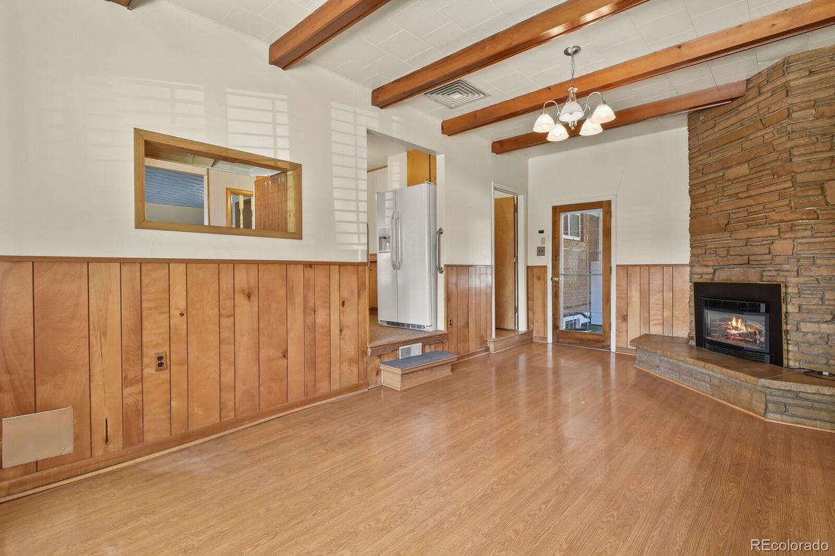 Chandelier, Empty room, Fireplace, Interior, Stone Walls, Wooden Beams, Wood Texture Flooring