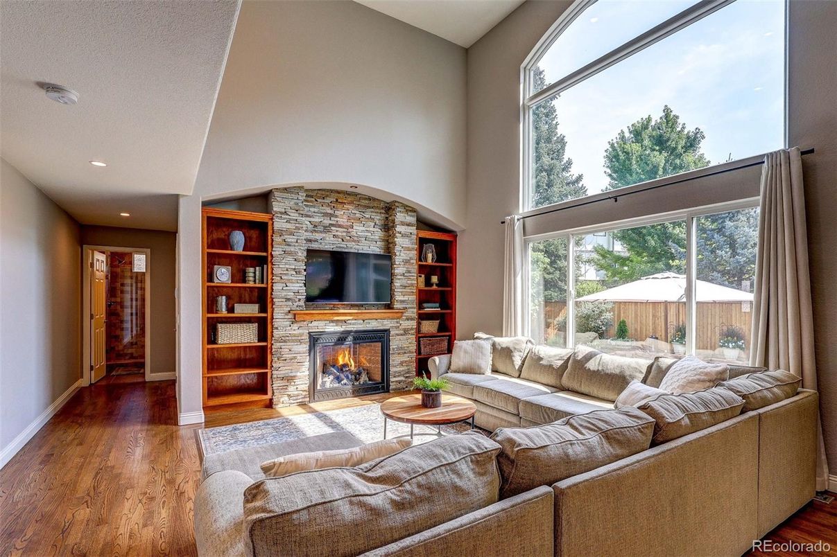 Fireplace, Interior, Living room, Recessed Lighting, Stone Walls, Wood Texture Flooring