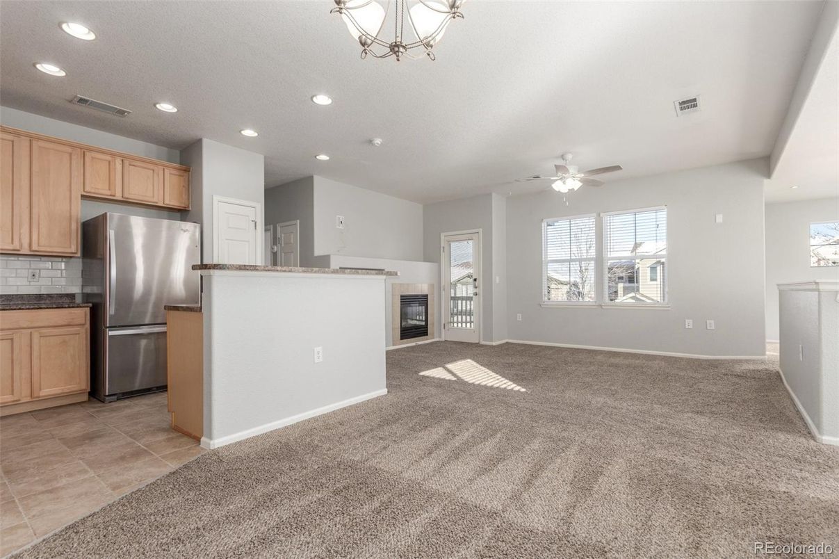Empty room, Fireplace, Interior, Kitchen, Recessed Lighting, Stainless Steel Appliances