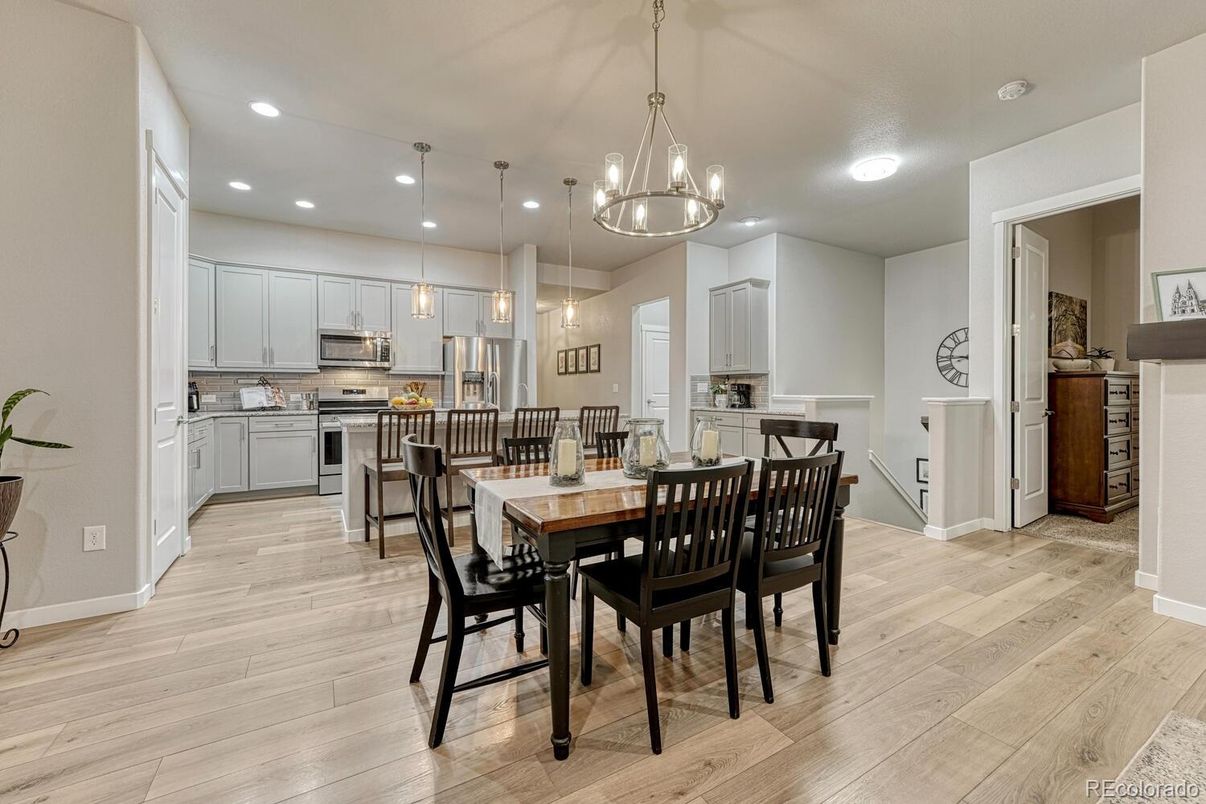 Dining room, Interior, Kitchen, Pendant Lights, Recessed Lighting, Stainless Steel Appliances, Wood Texture Flooring