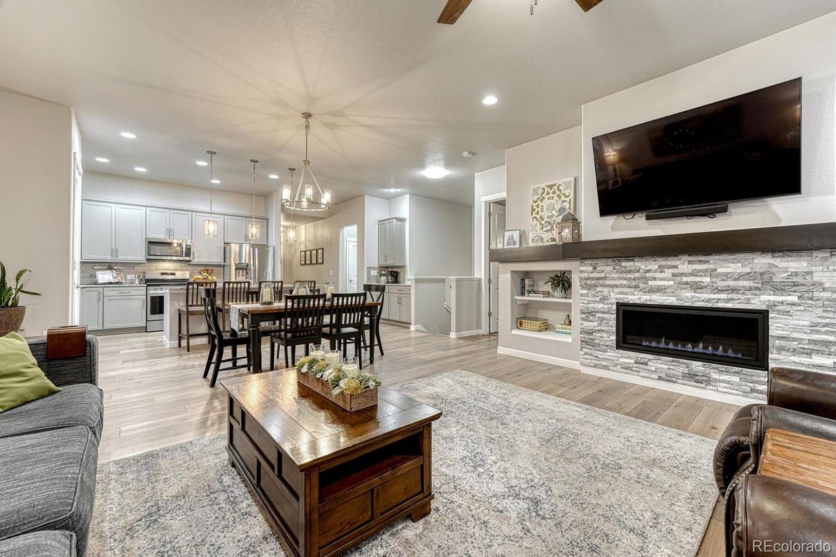 Dining room, Fireplace, Interior, Kitchen, Pendant Lights, Recessed Lighting, Stainless Steel Appliances, Wood Texture Flooring