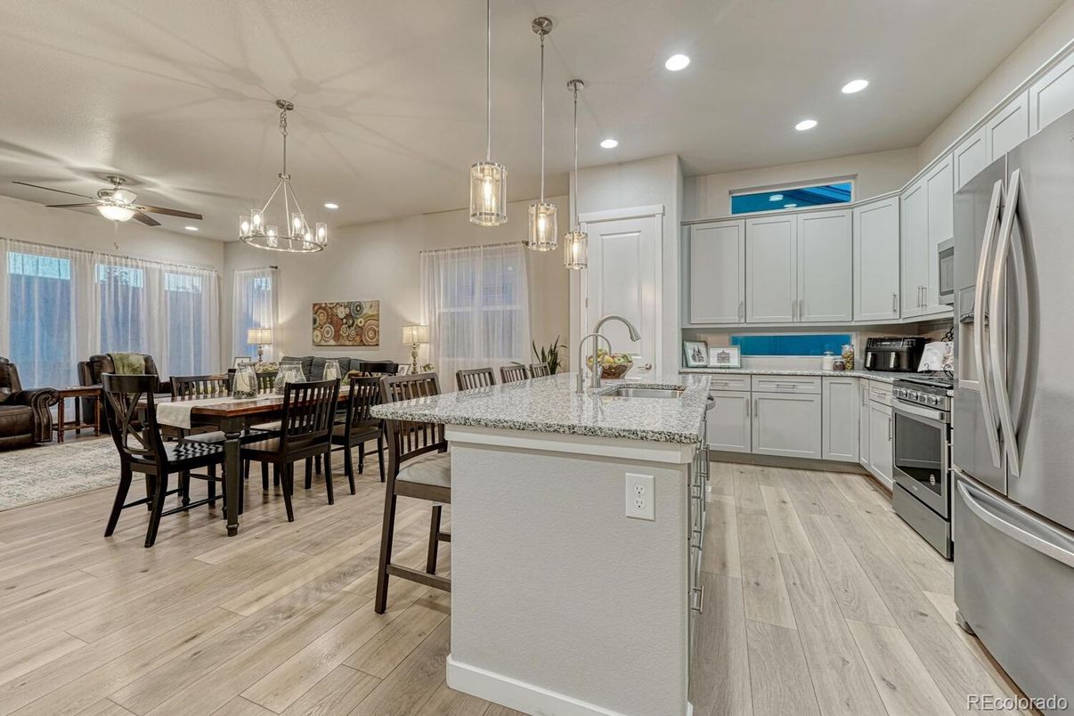 Dining room, Interior, Kitchen, Pendant Lights, Recessed Lighting, Stainless Steel Appliances, Wood Texture Flooring