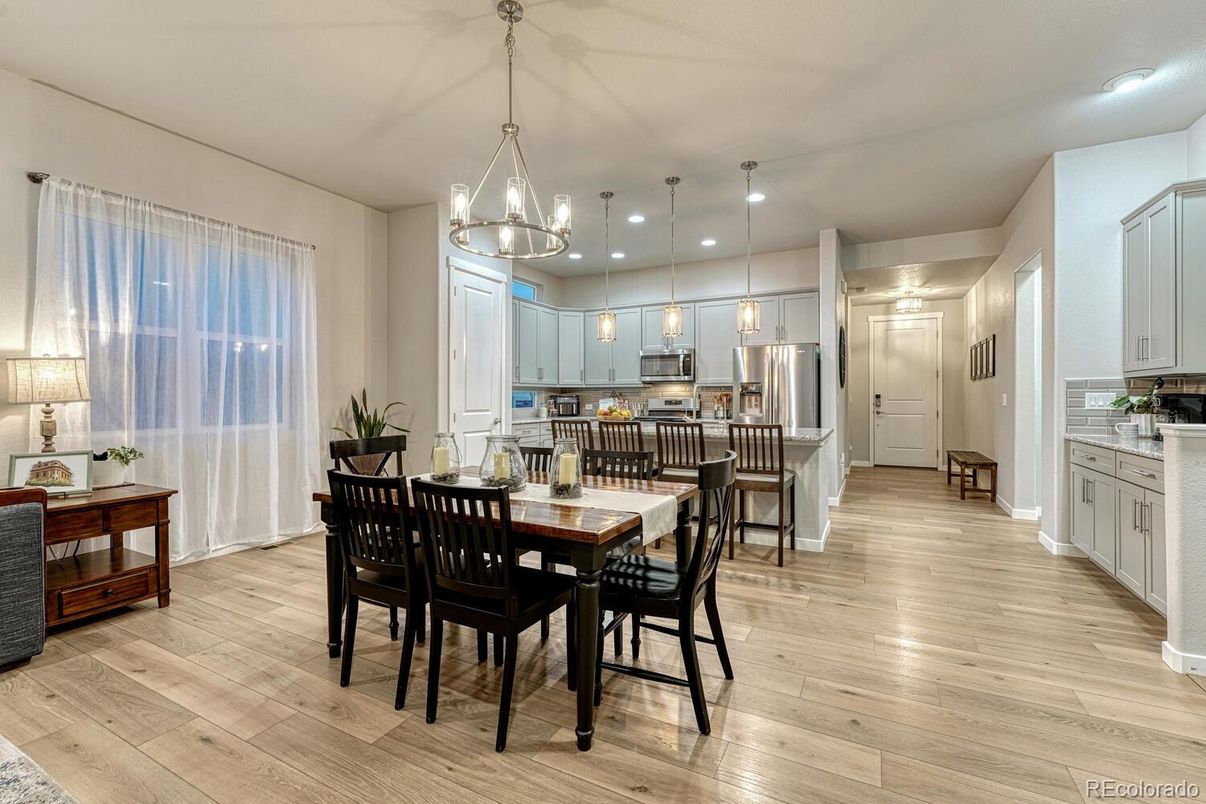 Dining room, Interior, Kitchen, Pendant Lights, Recessed Lighting, Stainless Steel Appliances, Wood Texture Flooring
